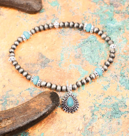 TOPEKA TURQUOISE AND SILVER PEARL TEARDROP CONCHO BRACELET